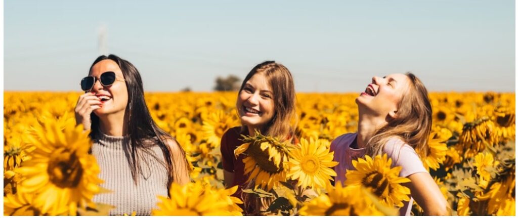 three ladies laughing and enjoying the sunshine